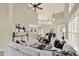 Open-concept living space with high ceilings, tile flooring, and combined dining area in a bright and airy layout at 6439 Gentle Ben Cir, Wesley Chapel, FL 33544