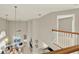 Bright living room with high ceilings, chandelier, ceiling fan, and neutral walls at 6439 Gentle Ben Cir, Wesley Chapel, FL 33544