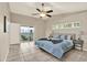 The main bedroom boasts a private balcony and a ceiling fan at 6439 Gentle Ben Cir, Wesley Chapel, FL 33544