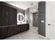 Modern bathroom with unique wall texture, an LED mirror, a vanity, and a glass-enclosed shower at 777 3Rd N Ave # 1304, St Petersburg, FL 33701