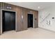 Modern elevator lobby with wood paneling and clear signage for easy navigation at 777 3Rd N Ave # 1304, St Petersburg, FL 33701