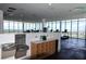 Bright gym featuring multiple exercise machines and floor-to-ceiling windows with city views at 777 3Rd N Ave # 1304, St Petersburg, FL 33701