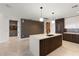 Modern kitchen with an island, stylish cabinetry and lighting, and sleek appliances at 777 3Rd N Ave # 1304, St Petersburg, FL 33701