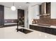 Modern kitchen featuring a waterfall island, stainless steel appliances, and sleek cabinetry for a contemporary design at 777 3Rd N Ave # 1304, St Petersburg, FL 33701