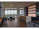 Open-concept living area features a sleek kitchen with a breakfast bar, an adjacent dining area and bar seating at 777 3Rd N Ave # 1304, St Petersburg, FL 33701