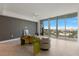 Bright living room with floor-to-ceiling windows offering scenic city views and modern decor at 777 3Rd N Ave # 1304, St Petersburg, FL 33701