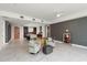 Open-concept living room with stylish seating, adjacent kitchen, and modern tiled floors at 777 3Rd N Ave # 1304, St Petersburg, FL 33701