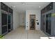 Bright lobby area featuring tile floors, a shower, and doors leading outside at 777 3Rd N Ave # 1304, St Petersburg, FL 33701