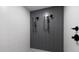 Sleek walk-in shower with gray accent tiles, dual shower heads and hand held sprayer at 777 3Rd N Ave # 1304, St Petersburg, FL 33701
