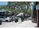 Charming street view of cafes and shops with lush trees providing shade at 777 3Rd N Ave # 1304, St Petersburg, FL 33701