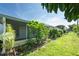 Lush green lawn with plants and greenery in a garden in backyard at 8451 Candlewood Rd # 8451, Seminole, FL 33777