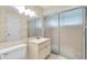 Bathroom featuring a vanity with a sink, large mirror, toilet, and walk in shower at 8451 Candlewood Rd # 8451, Seminole, FL 33777