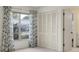 Bedroom with view to the exterior, closet and ensuite bathroom at 8451 Candlewood Rd # 8451, Seminole, FL 33777