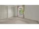 Bedroom with view to the exterior and double closet at 8451 Candlewood Rd # 8451, Seminole, FL 33777
