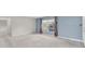 Comfortable living room with a large window and neutral carpet, offering a versatile space for various activities at 8451 Candlewood Rd # 8451, Seminole, FL 33777