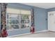 Bright living room featuring a large window that offers natural light and views of the outdoors at 8451 Candlewood Rd # 8451, Seminole, FL 33777