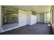 Covered screened-in patio area with lush green landscaping at 8451 Candlewood Rd # 8451, Seminole, FL 33777