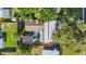 Aerial view of a house showcasing its roof, yard, and surrounding trees at 8537 93Rd Ave, Seminole, FL 33777