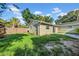 A wide-open backyard with a wooden fence that provides privacy at 8537 93Rd Ave, Seminole, FL 33777