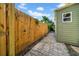 View of a wood fence and pavers along the side of the home at 8537 93Rd Ave, Seminole, FL 33777
