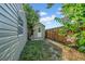 View of backyard showing the storage shed with a wooden privacy fence at 8537 93Rd Ave, Seminole, FL 33777