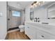 Bathroom featuring sleek vanity with matte black faucet and modern shower with marble tile at 8537 93Rd Ave, Seminole, FL 33777