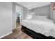 Comfortable bedroom with warm wood floors, air conditioning and a doorway to another room at 8537 93Rd Ave, Seminole, FL 33777