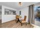 Bright dining area with wood floors, a round table with seating for two, and access to the outdoor patio at 8537 93Rd Ave, Seminole, FL 33777