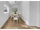 Bright dining room with wood floors, window view, and decor at 8537 93Rd Ave, Seminole, FL 33777