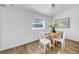 This simple dining room with wood floors and a view from the window is sure to please at 8537 93Rd Ave, Seminole, FL 33777