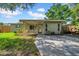 Charming single-story home with a covered porch and well-maintained front yard at 8537 93Rd Ave, Seminole, FL 33777