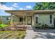 The front exterior showcases a cozy porch and well-maintained landscaping at 8537 93Rd Ave, Seminole, FL 33777
