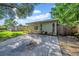 Single story home featuring a well manicured lawn, covered porch, and a concrete driveway at 8537 93Rd Ave, Seminole, FL 33777