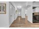 Bright hallway with wood floors that leads to the front door and dining room at 8537 93Rd Ave, Seminole, FL 33777