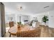Open-concept living and dining area with wood floors and ample natural light at 8537 93Rd Ave, Seminole, FL 33777