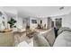 Bright living room with modern decor, a comfortable sofa, decorative rug, and access to an outdoor patio at 8537 93Rd Ave, Seminole, FL 33777