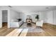 Comfortable living room featuring wood floors, modern decor, a comfortable sofa, and lots of natural light at 8537 93Rd Ave, Seminole, FL 33777
