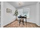 Office space with modern light fixture, large window, and sleek desk and rug at 8537 93Rd Ave, Seminole, FL 33777