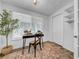 Office space with modern light fixture, large window, and sleek desk and rug at 8537 93Rd Ave, Seminole, FL 33777