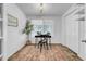 Office space with modern light fixture, large window, and sleek desk and rug at 8537 93Rd Ave, Seminole, FL 33777
