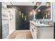 Chic bathroom with double sinks, granite counters, and sleek, modern fixtures at 9028 Forge Breeze Loop, Wesley Chapel, FL 33545