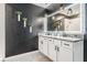 Contemporary bathroom showcasing double sinks and stylish hanging planters on the wall at 9028 Forge Breeze Loop, Wesley Chapel, FL 33545