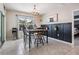 Bright dining area features natural light, black accent wall, and stylish decor at 9028 Forge Breeze Loop, Wesley Chapel, FL 33545