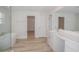 Modern bathroom with a soaking tub, separate shower, and double vanity at 10036 Surrey Rose Dr, San Antonio, FL 33576