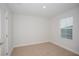 Well-lit bedroom with a window providing natural light and fresh air at 10036 Surrey Rose Dr, San Antonio, FL 33576