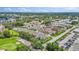 Aerial view of the townhome community, golf course, and surrounding landscape at 1050 Starkey Rd # 704, Largo, FL 33771