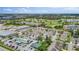 Community aerial showcasing residential buildings, golf course, and other commercial properties nearby at 1050 Starkey Rd # 704, Largo, FL 33771