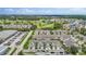Community aerial showcasing residential buildings, a golf course, and manicured green spaces at 1050 Starkey Rd # 704, Largo, FL 33771