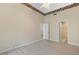 A bright and airy bedroom featuring decorative ceiling trim, neutral walls, and modern wood laminate flooring at 1050 Starkey Rd # 704, Largo, FL 33771