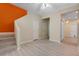 Inviting hallway with light wood floors, neutral walls, and stairway leading to another level at 1050 Starkey Rd # 704, Largo, FL 33771